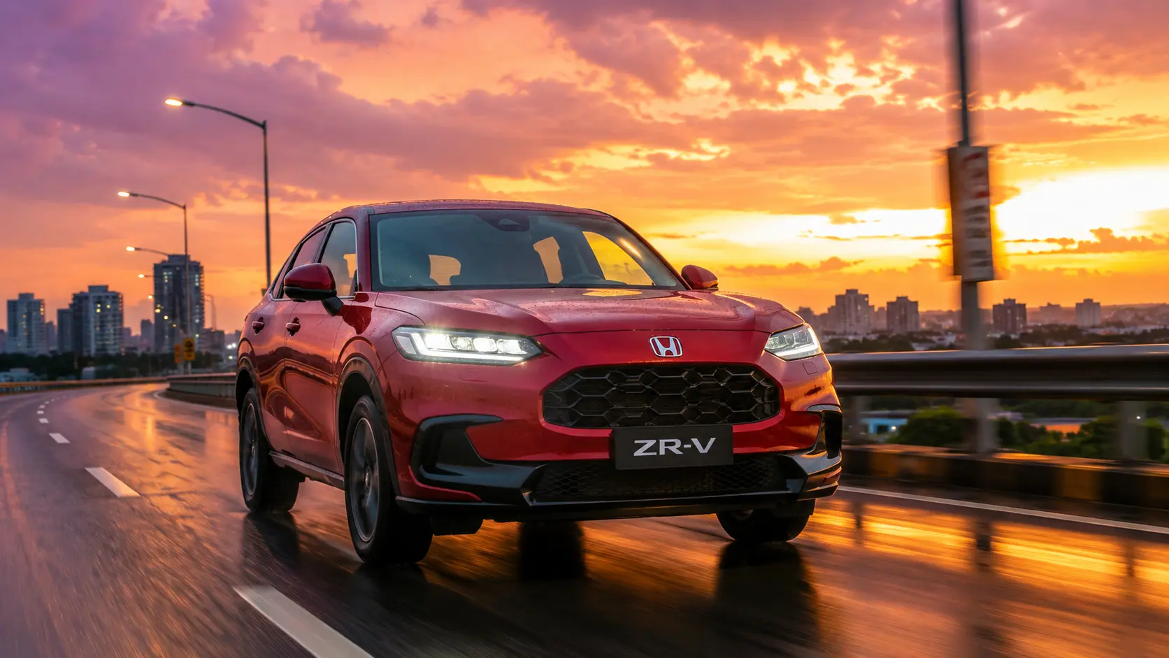 Metallic Red Honda ZR-V premium hybrid SUV driving on a clean Indian highway at sunset.
